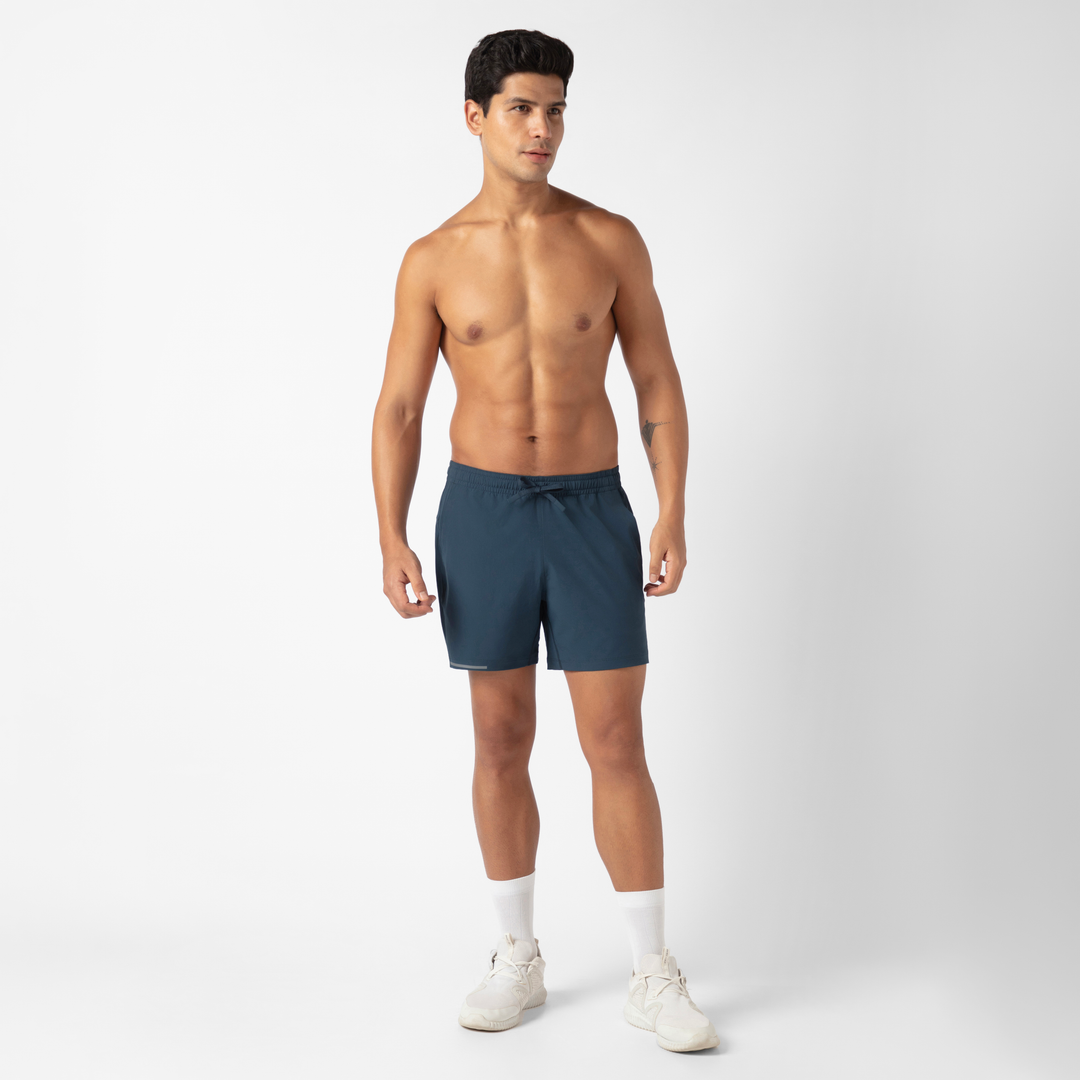 Run Short v2 5.5" in Navy front on model standing 