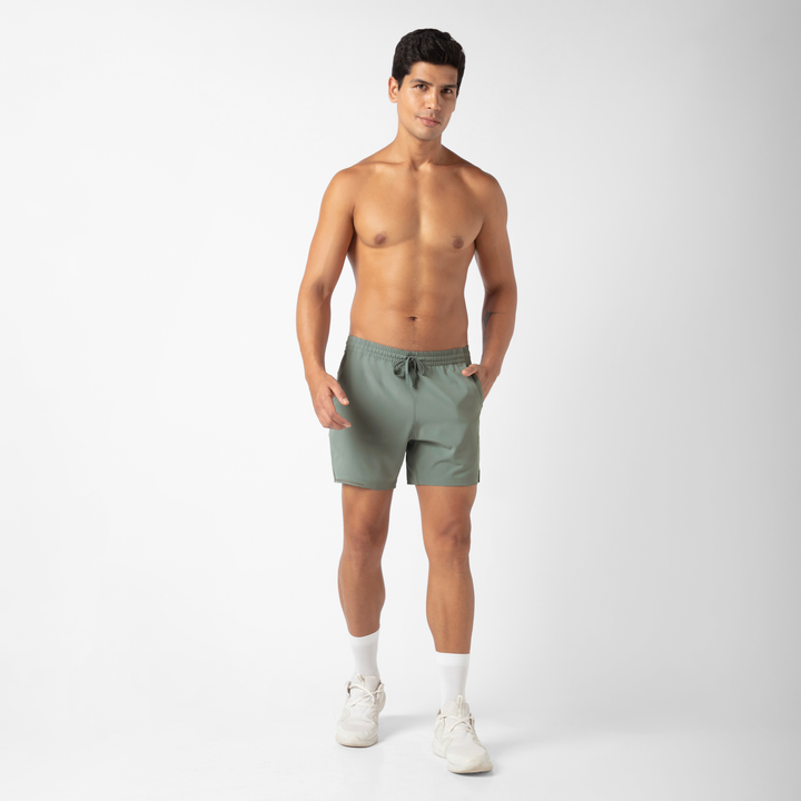 Run Short v2 5.5" in Shark Grey front on model standing with hand in pocket