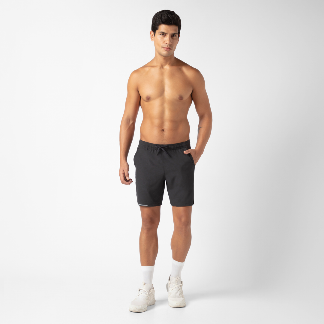 Run Short v2 7" in Black front on model standing with hand in pocket