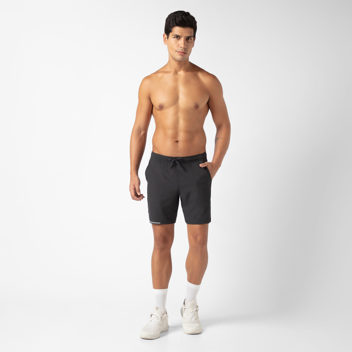 Run Short v2 7" in Black front on model standing with hand in pocket