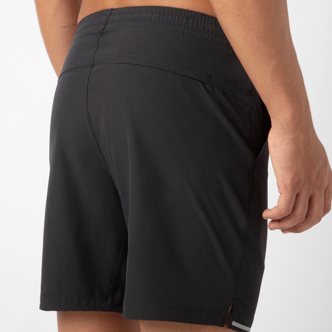 Run Short v2 7" in Black back on model close up of zipper pocket