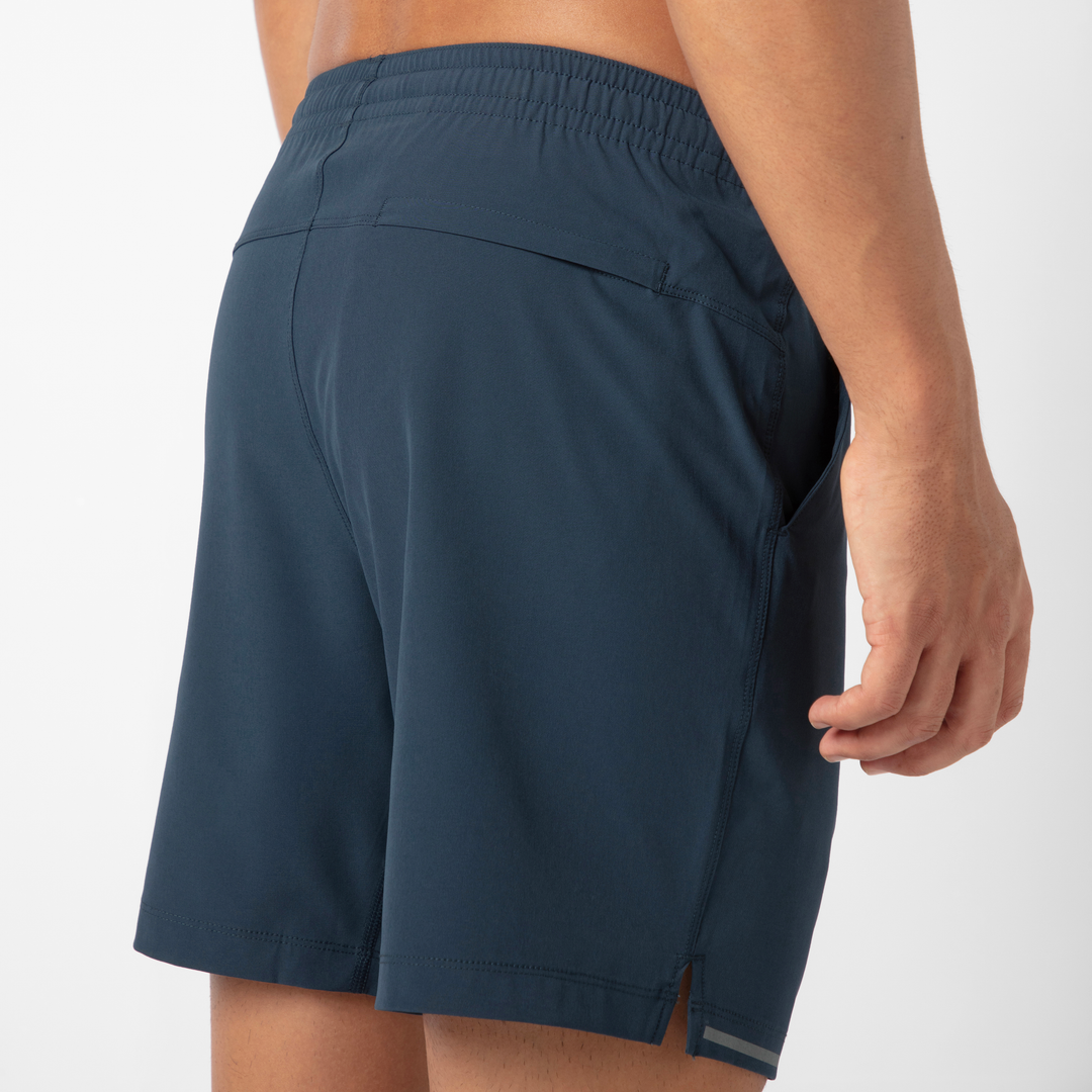 Run Short v2 7" Navy back on model close up of zipper pocket