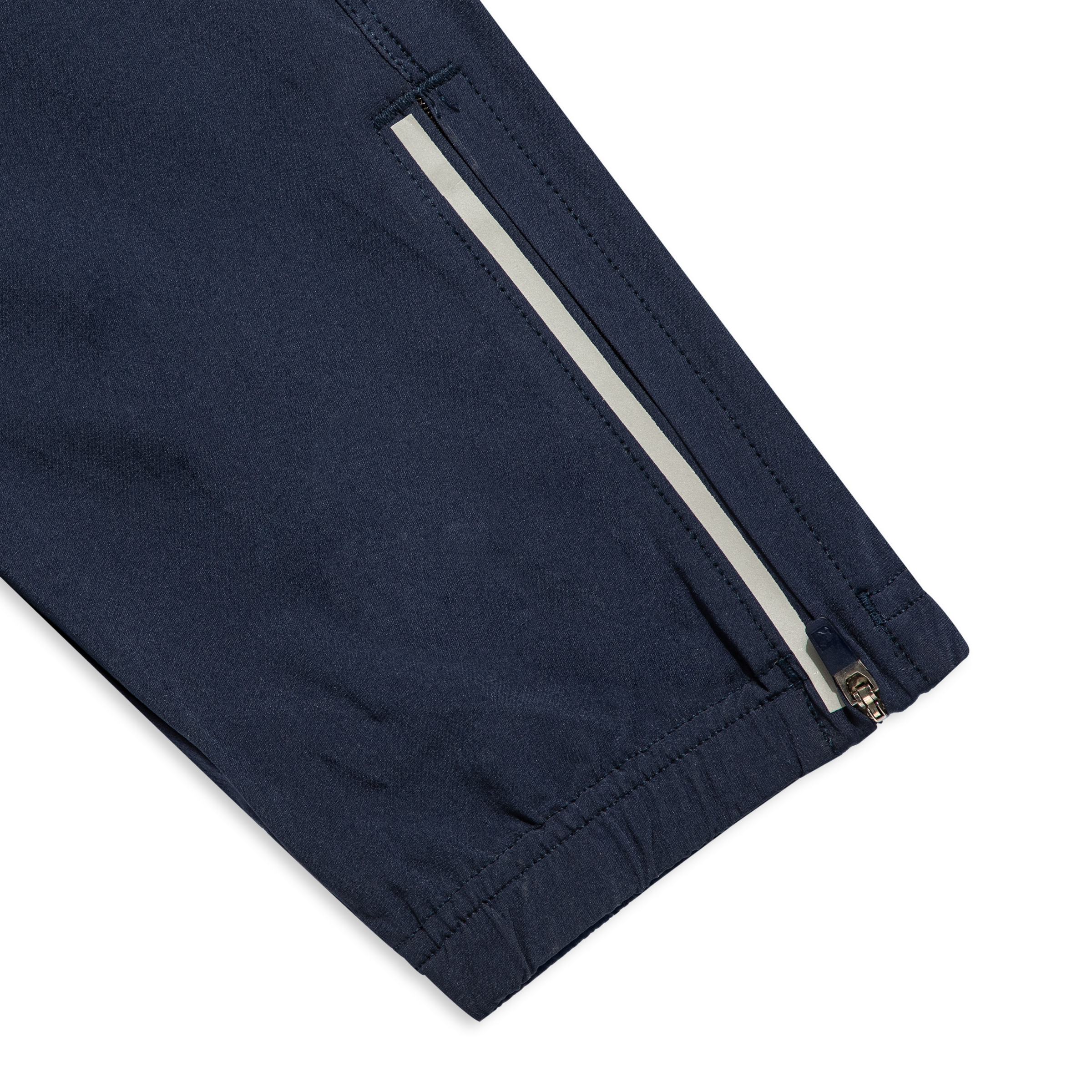 Run Jogger Navy close up zipper at ankles, and reflective strip at side seam/bottom hem
