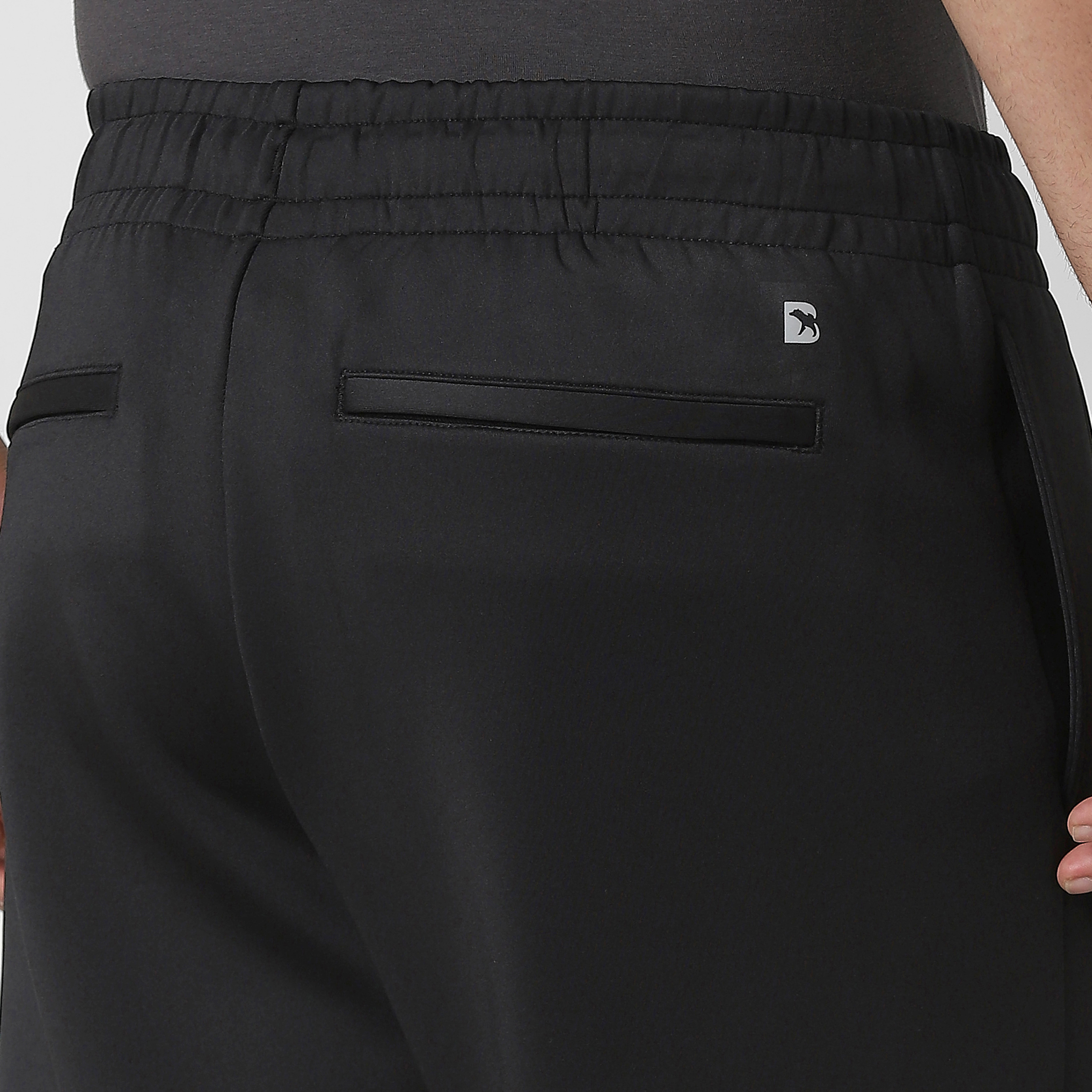 Scuba Jogger Black close up back zipper pockets on model