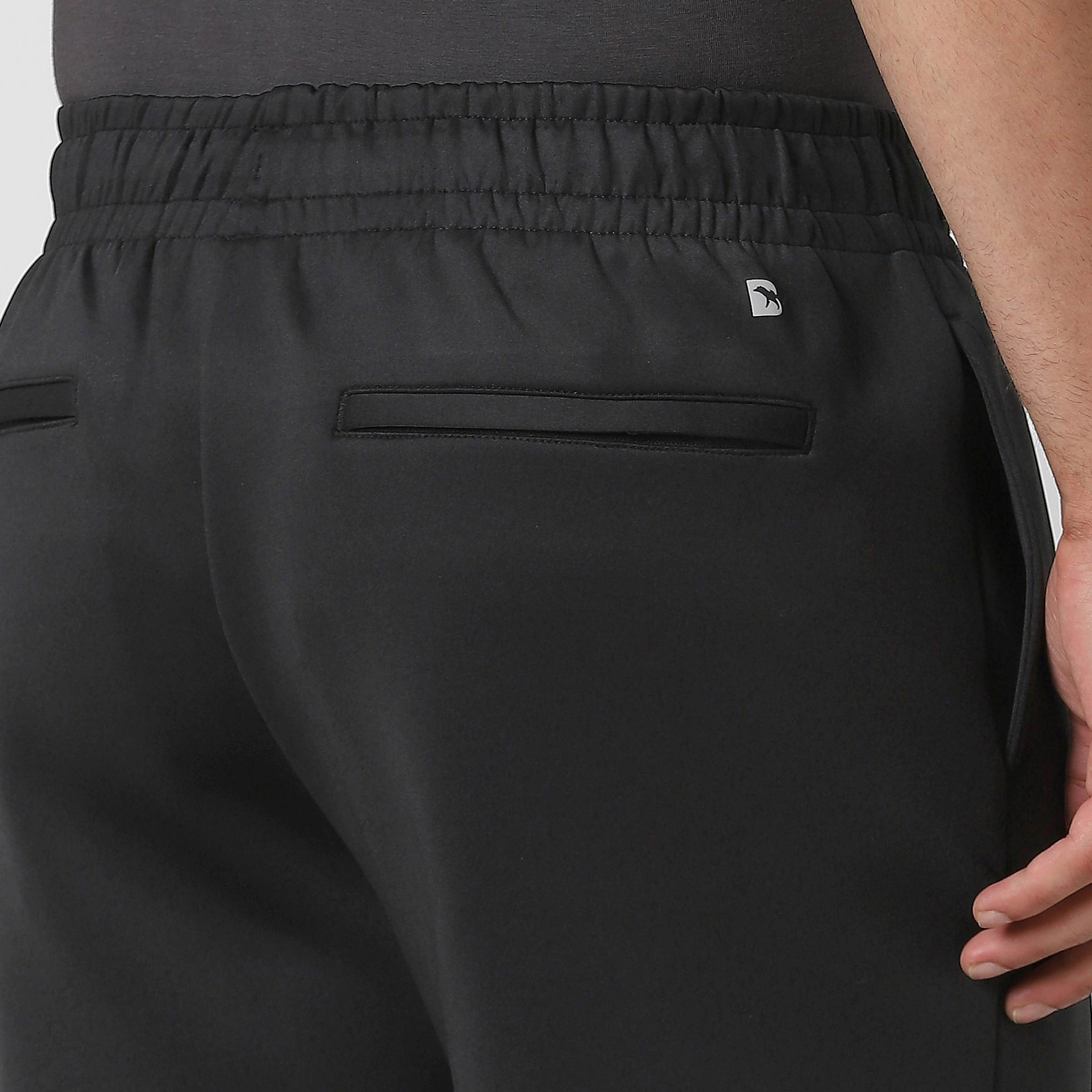 Scuba Short Black close up back zipper pockets on model