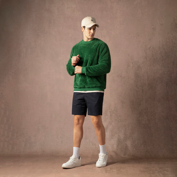 Sherpa Crewneck Duck Green full body on model on backdrop