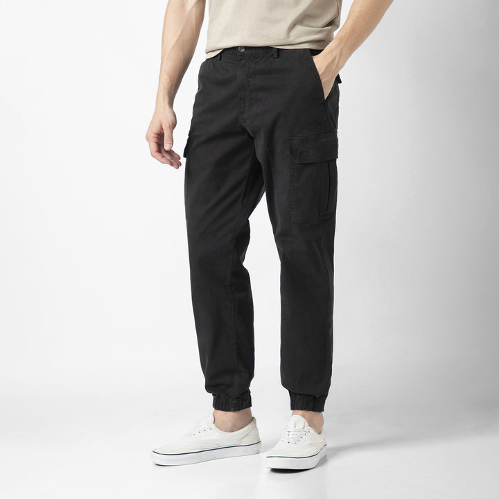 Model front facing wearing Stretch Cargo Joggers in Black