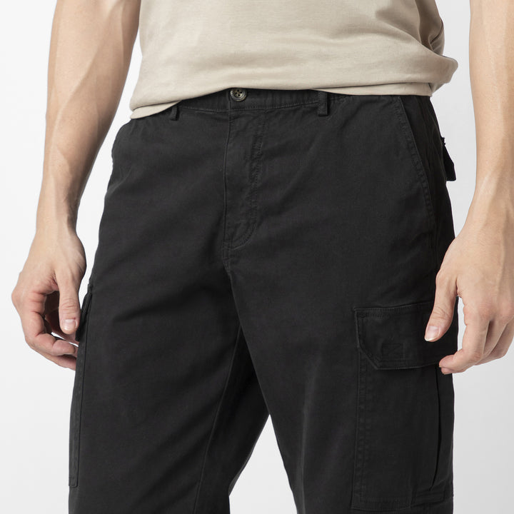 Model front facing wearing Stretch Cargo Joggers in Black