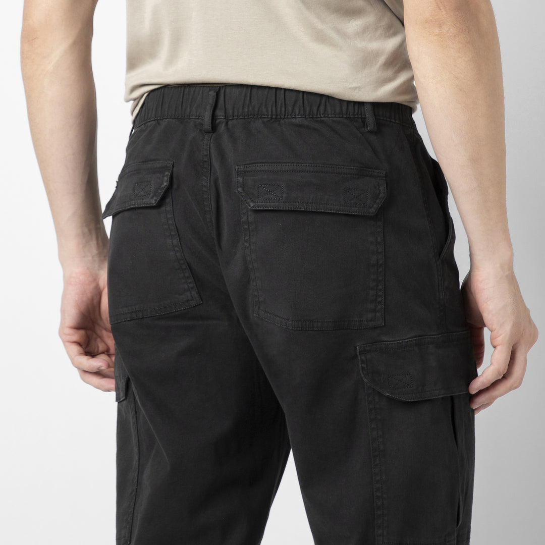 Model back facing wearing Stretch Cargo Joggers in Black