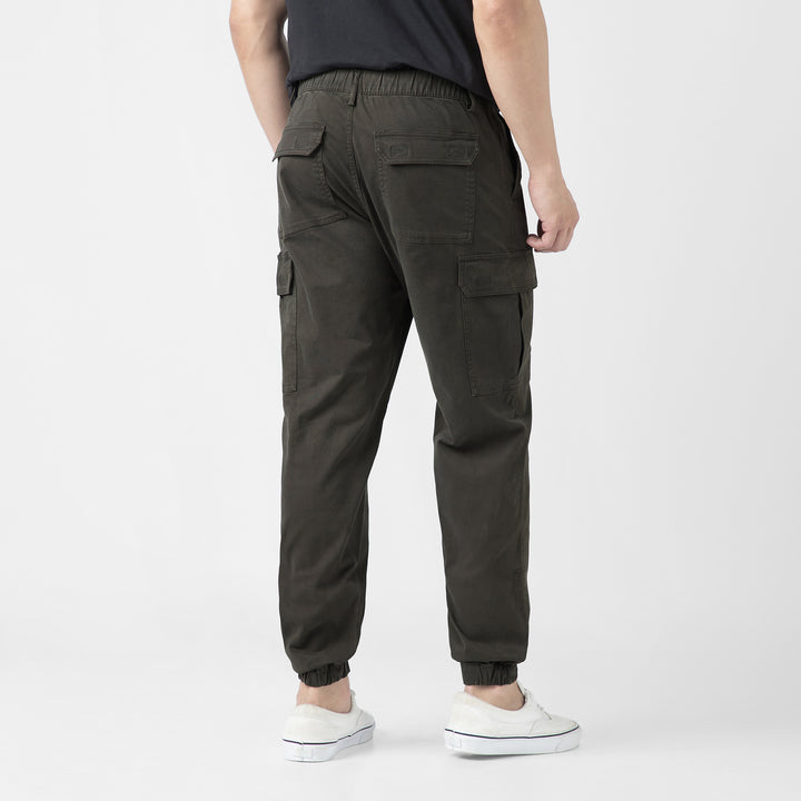 Model back facing wearing Stretch Cargo Joggers in Dark Grey