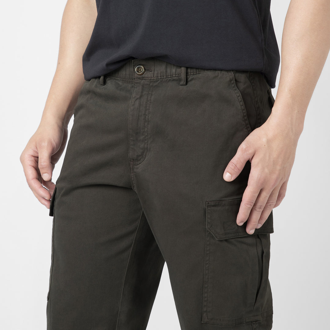 Model front facing wearing Stretch Cargo Joggers in Dark Grey