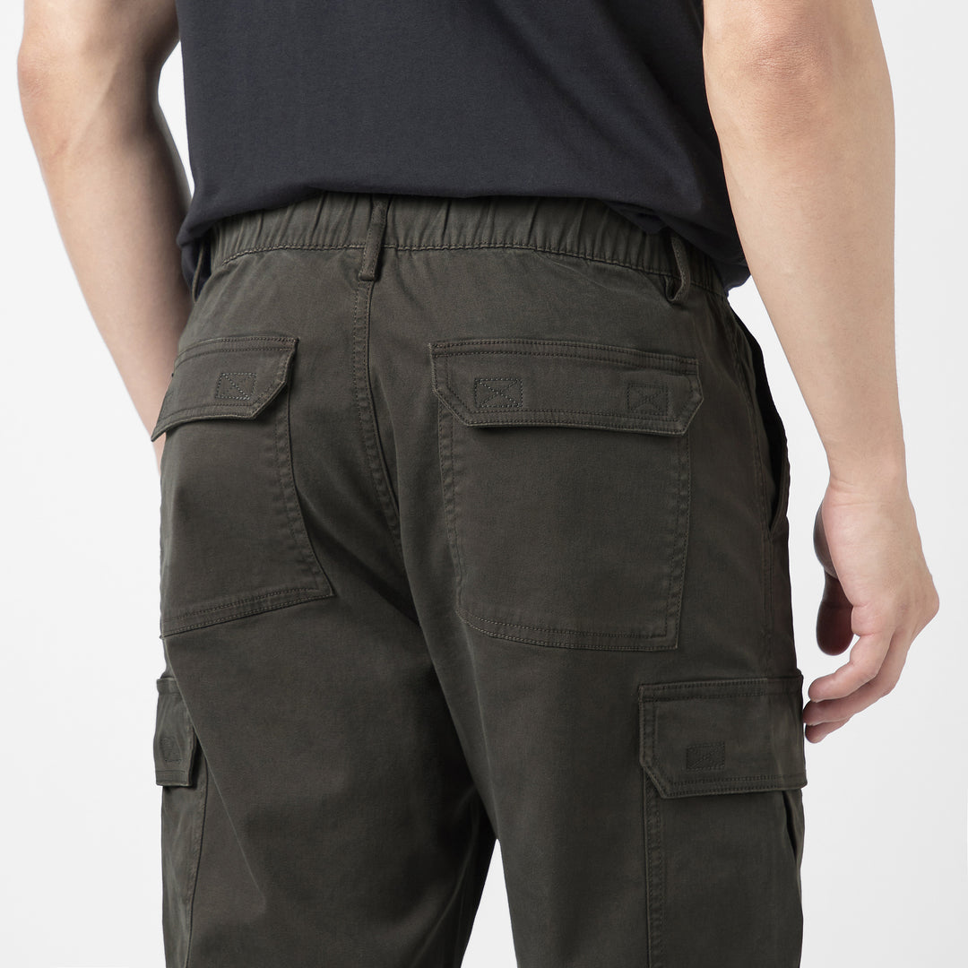 Model back facing wearing Stretch Cargo Joggers in Dark Grey