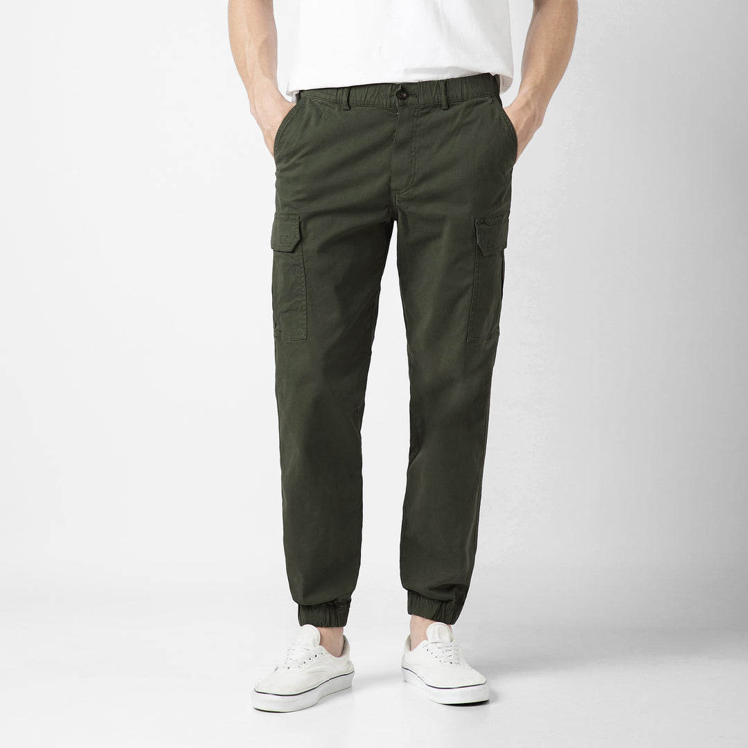 Model front facing wearing Stretch Cargo Joggers in Military Green
