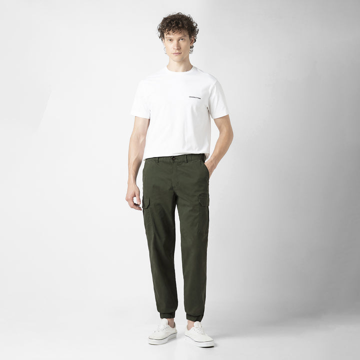 Model front facing wearing Stretch Cargo Joggers in Military Green