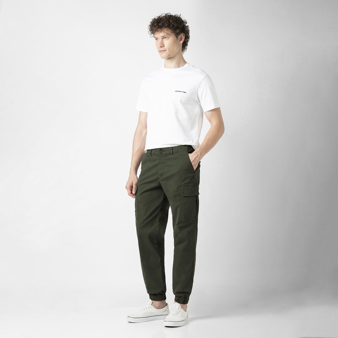 Model front facing wearing Stretch Cargo Joggers in Military Green