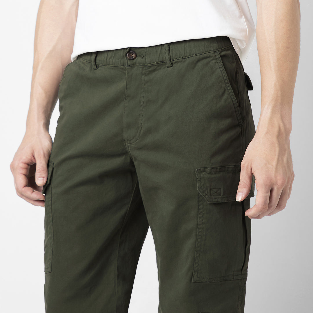 Model front facing wearing Stretch Cargo Joggers in Military Green