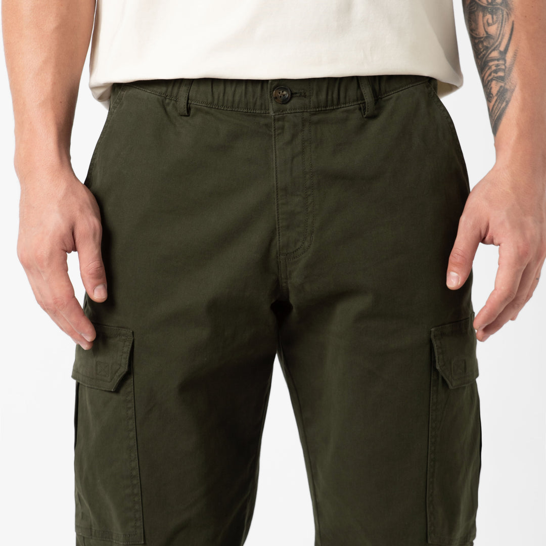 Stretch Cargo Pant Dark Pine close up on model