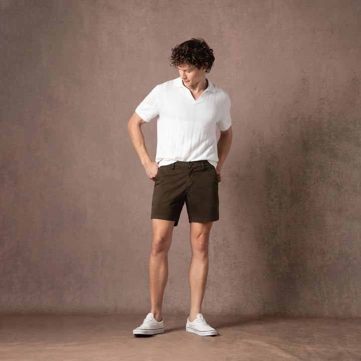 Stretch Chino Short 5.5" in Cocoa full body side on model with backdrop