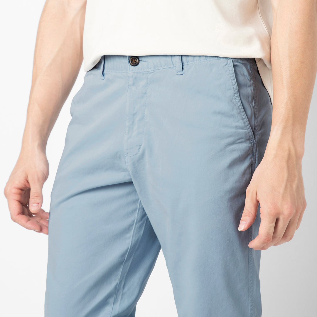 A close up of the Coastal light blue Stretch Jogger showing the premium cotton fabric, button closure, belt loops and slanted side pockets at the waist.
