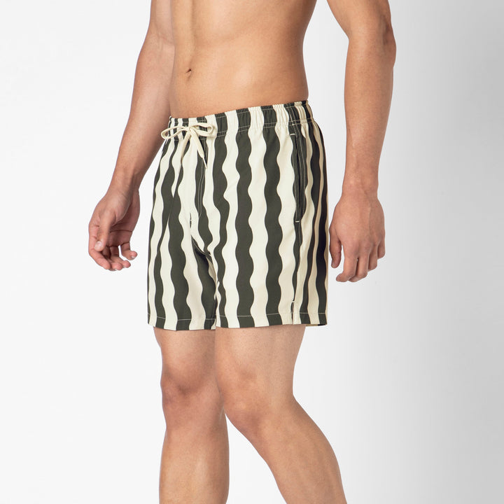 Stretch Swim Trunk (Clearance) in Orca Wavy Stripe, 5.5" inseam, shown from the side on a model with the side seam pocket visible.