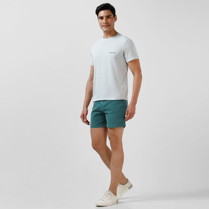 Stretch Short 5.5" Dark Teal front on model worn with Natural Dye Logo Tee Light Blue