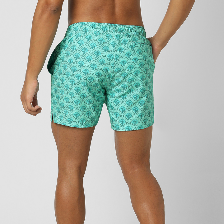 Stretch Swim Trunk (Clearance) in Shell, 5.5" inseam, shown from the back on a model with the zippered back right pocket visible.