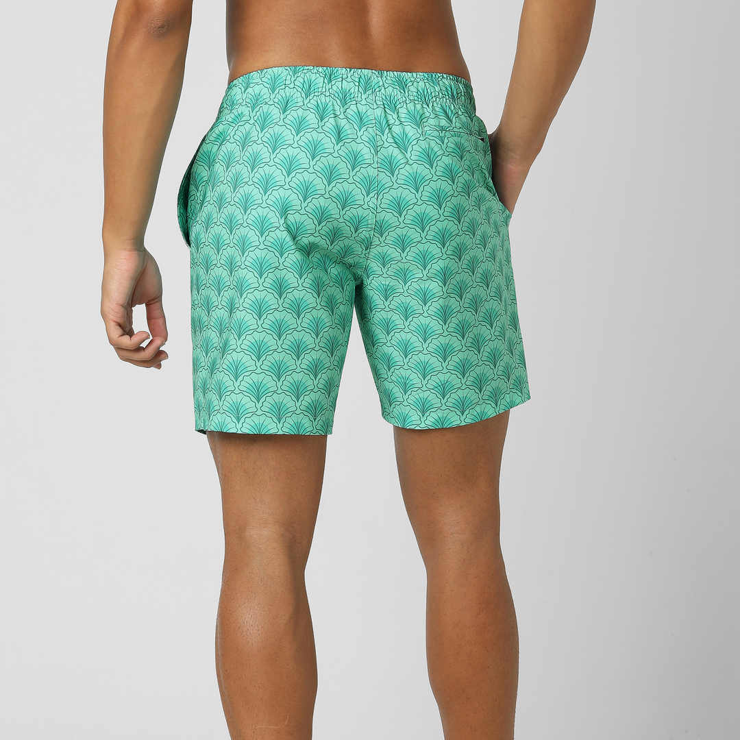 Stretch Swim Trunk (Clearance) in Shell, 7" inseam, shown from the back on a model with the zippered back right pocket visible.