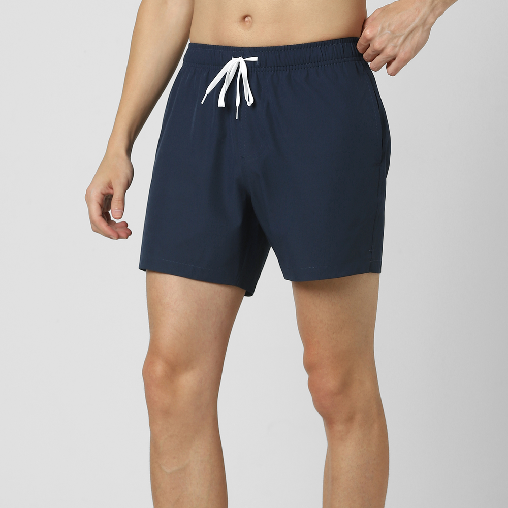 Stretch Swim Solid 5.5" Navy side on model