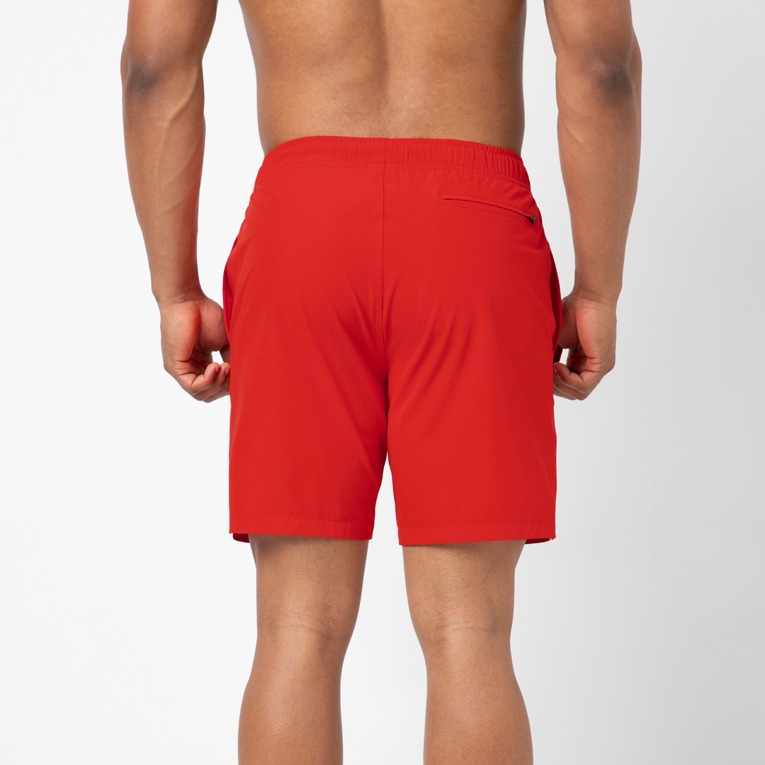 Stretch Swim Trunk (Clearance) in solid Red, 7" inseam, shown from the back on a model.