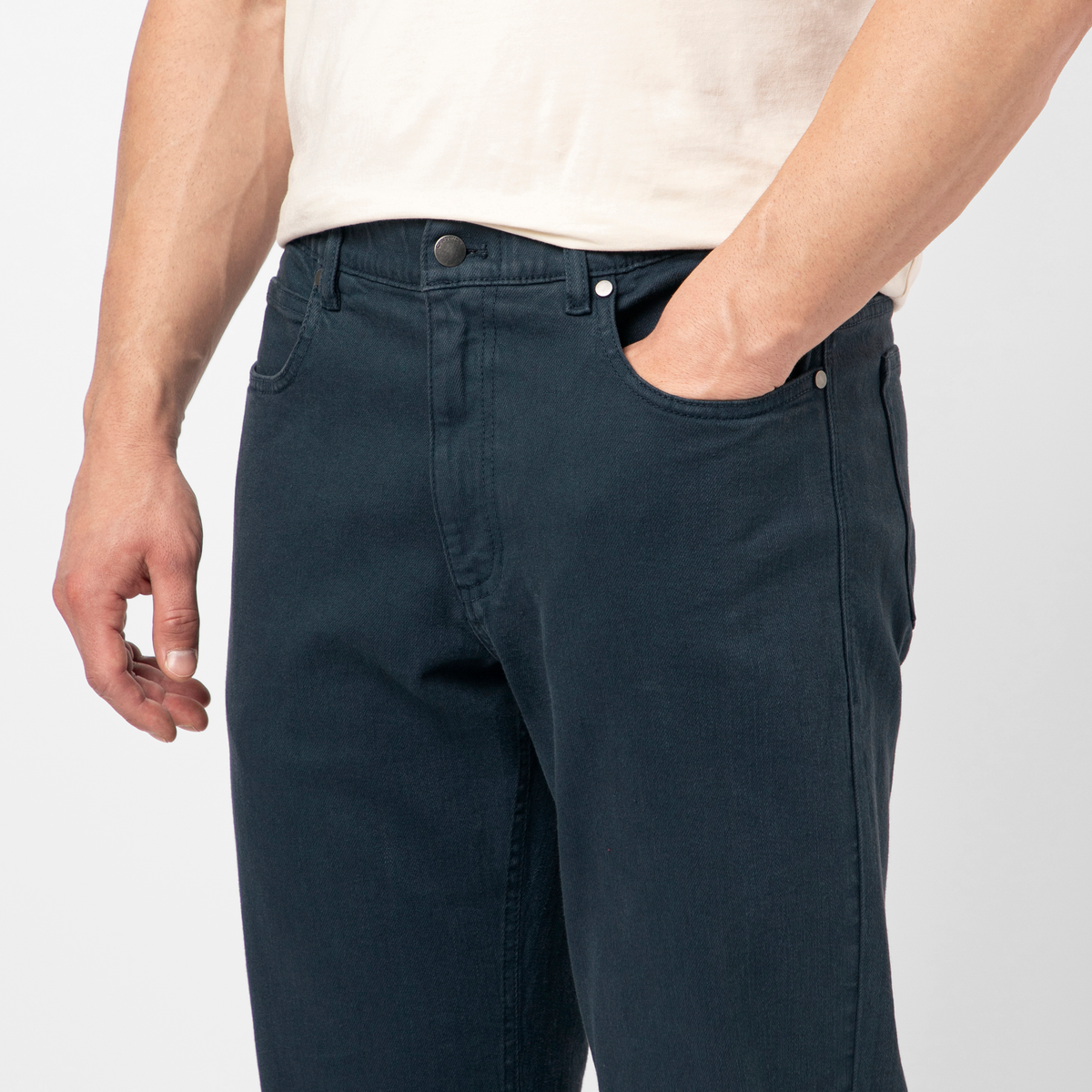 A close up photo of the Stretch Travel Jean in Navy. 