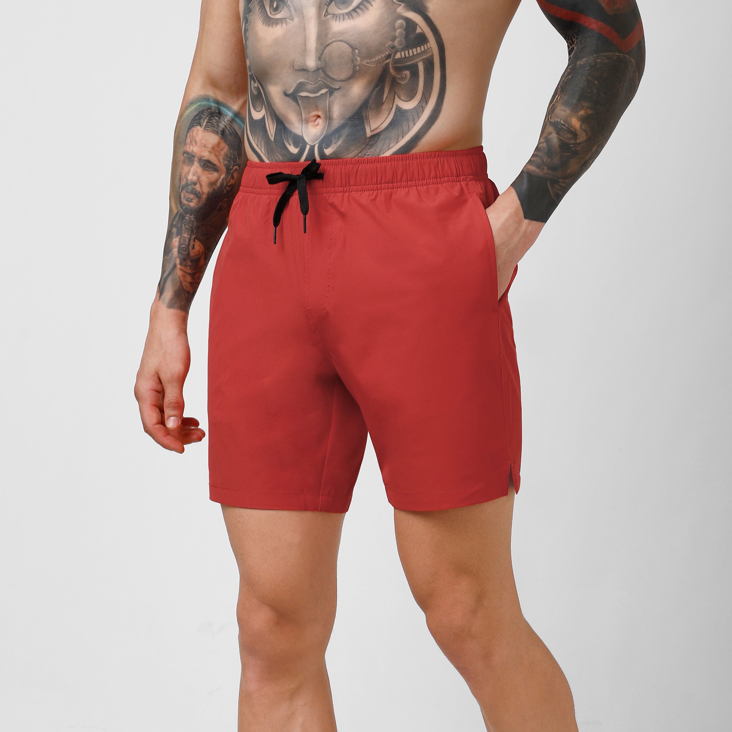 Stretch Swim 7" in Red side on model hand in pocket