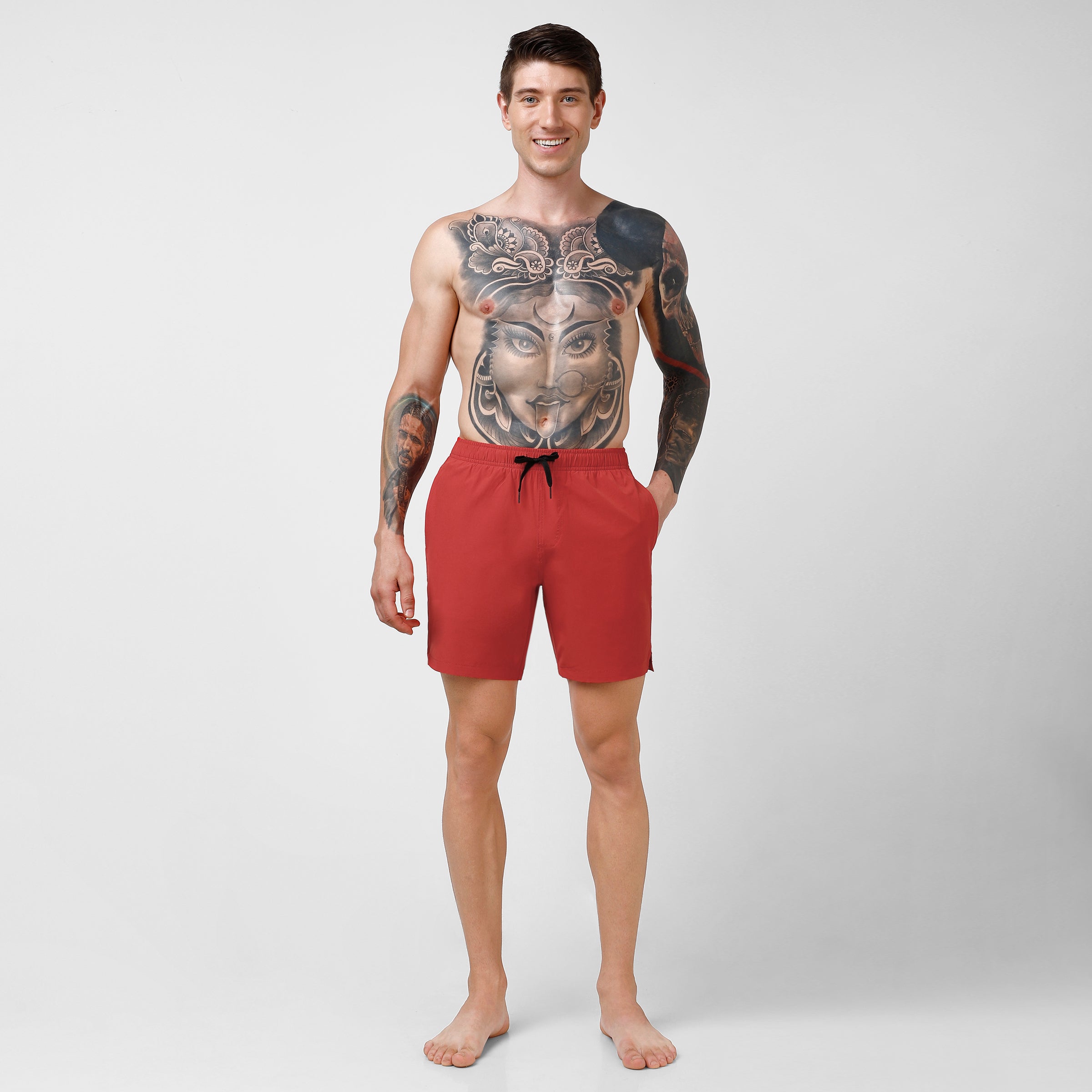 Stretch Swim 7" in Red full body on model standing hand in pocket