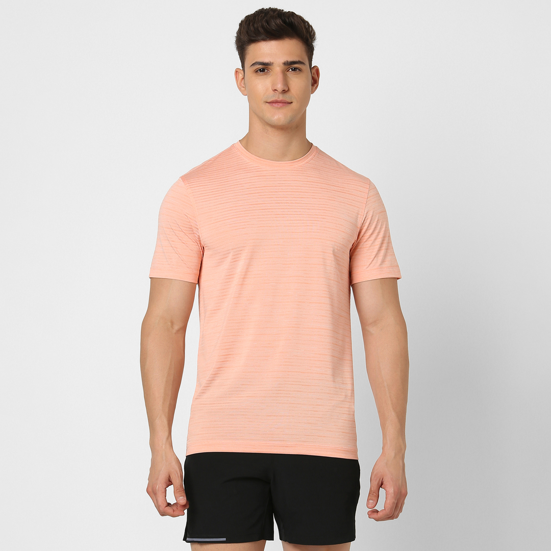 Stride Tee Coral front on model