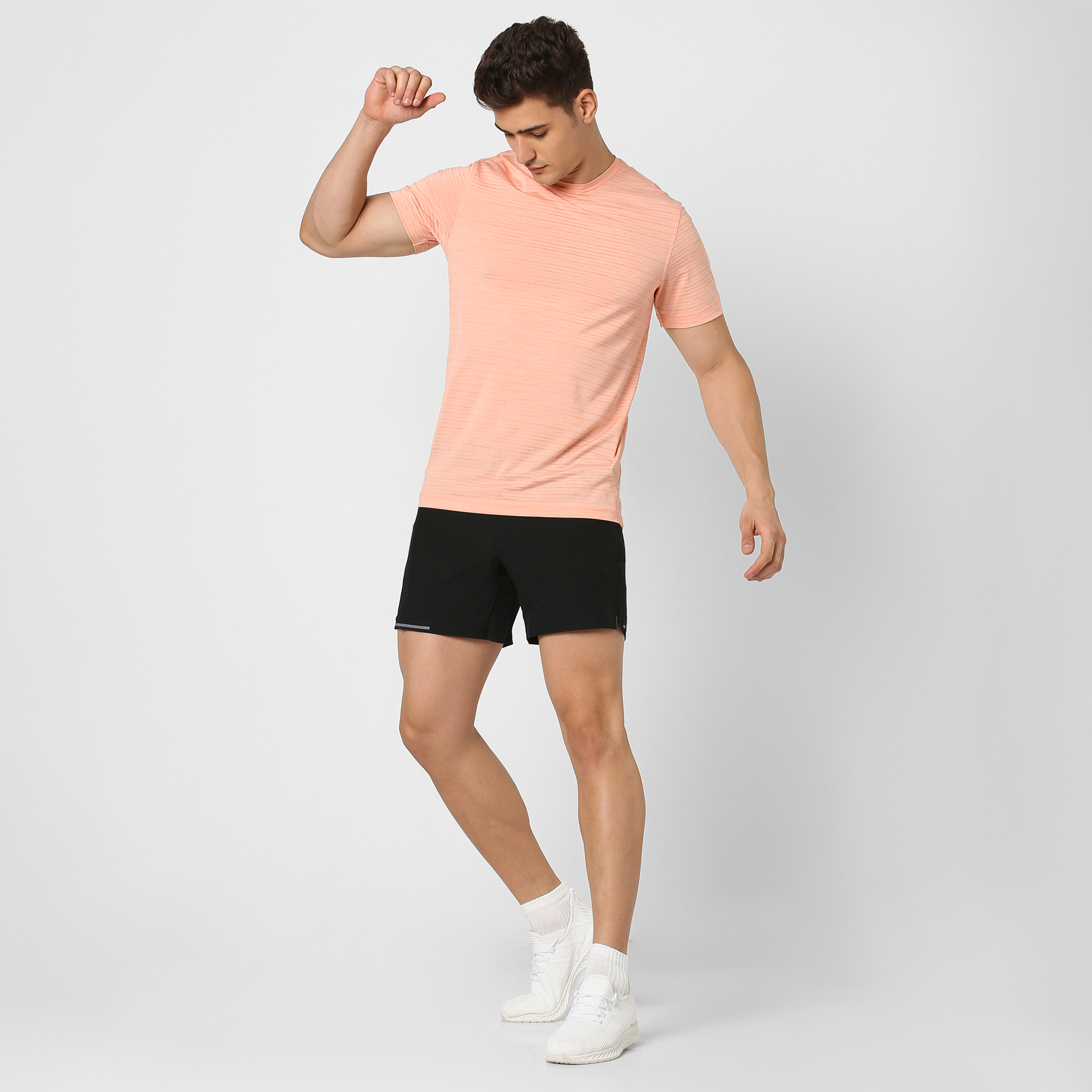 Stride Tee Coral full body on model