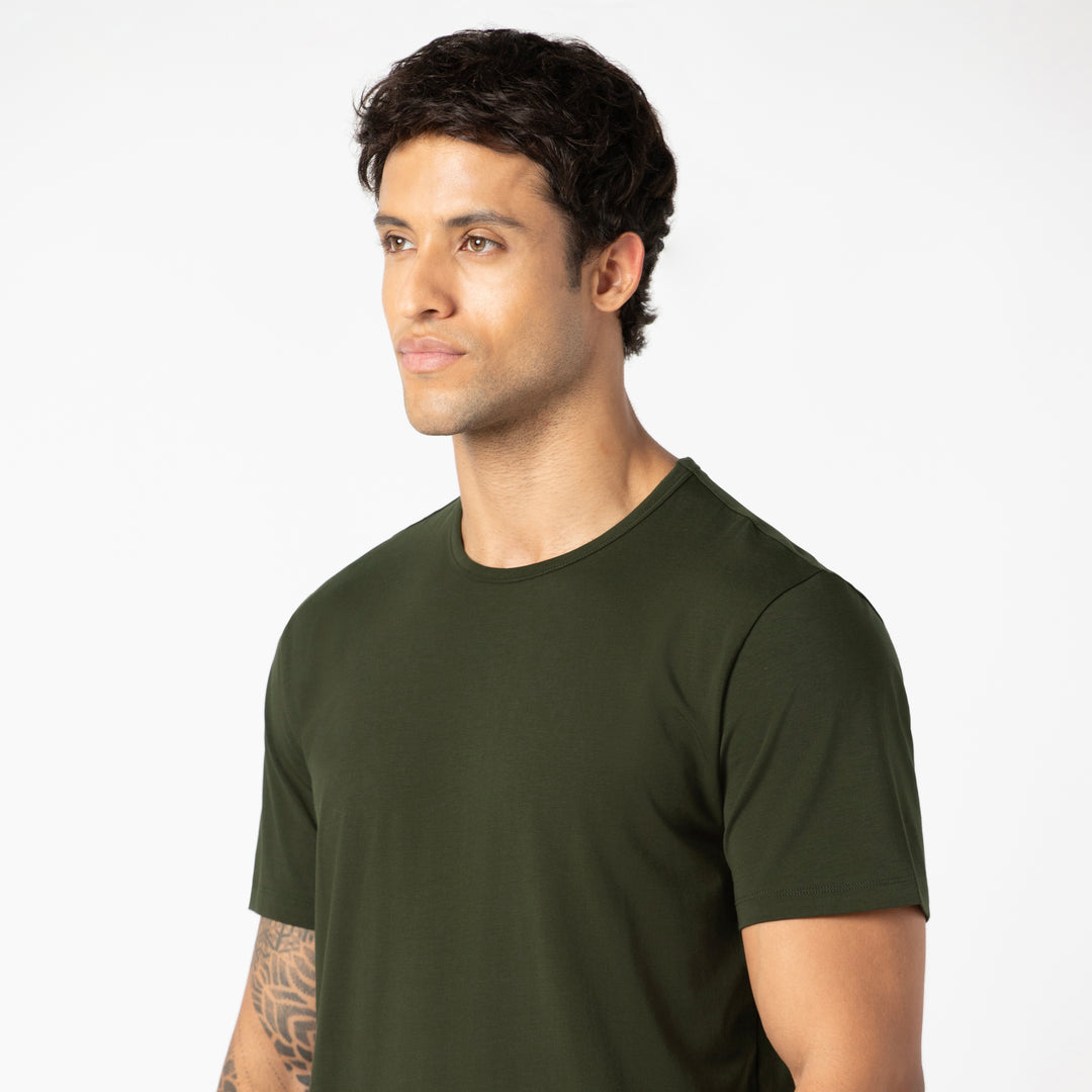 Supima Tee Dark Pine close up on model