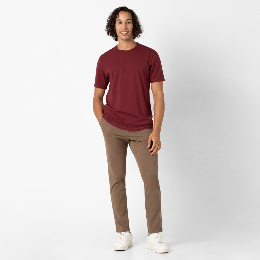 Supima Curved Tee Brick full body on model with Stretch Chino Pant Desert