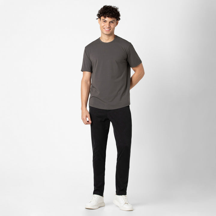 Supima Curved Tee Dark Grey full body on model with Stretch Chino Pant Black
