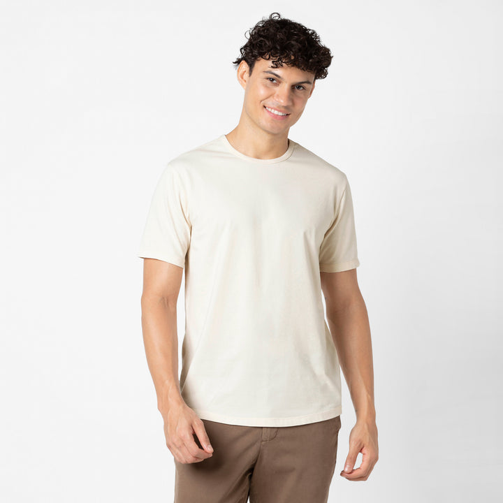 Supima Curved Tee Ecru front on model