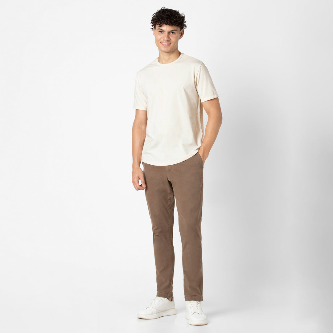 Supima Curved Tee Ecru full body on model with Stretch Chino Pant Desert