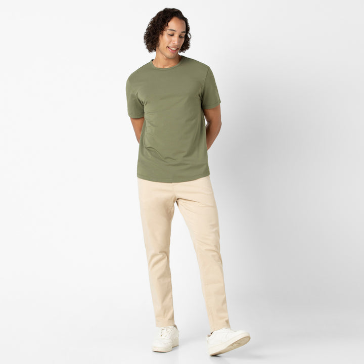 Supima Curved Tee Fern full body on model with Stretch Chino Pant Sand Dune