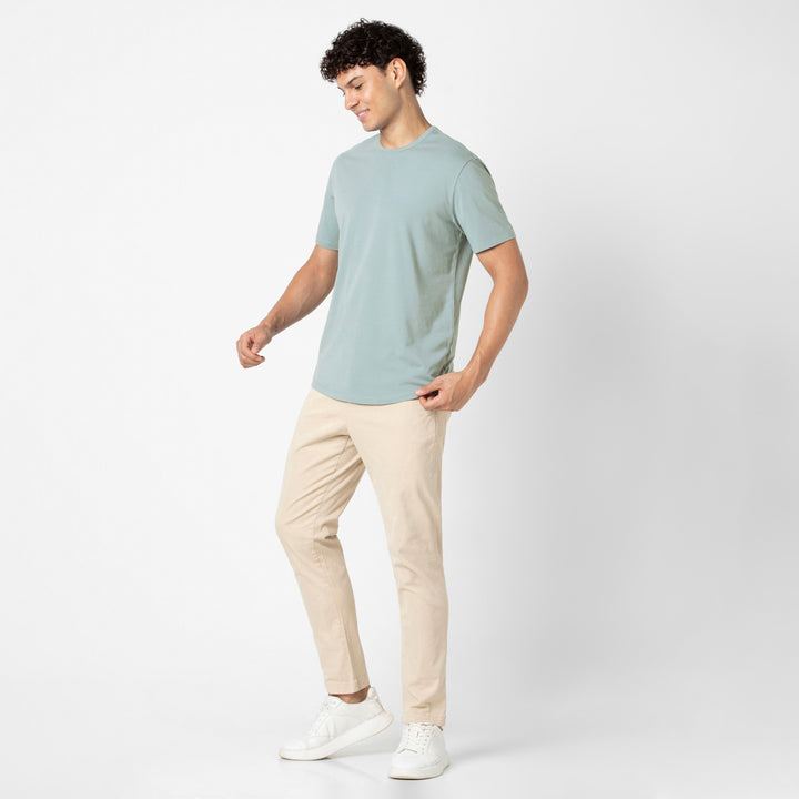Supima Curved Tee Shark full body on model with Stretch Chino Pant Sand Dune