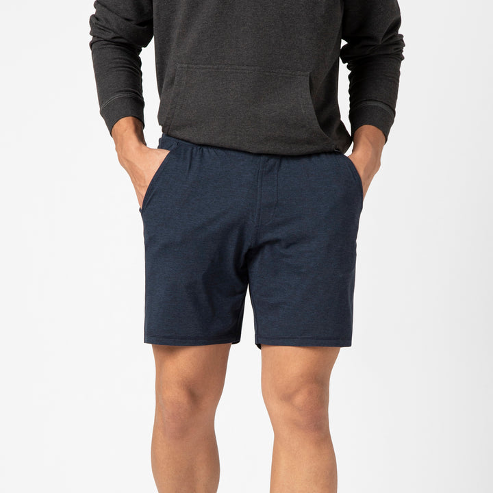 Tech Short 7 Navy on front on model