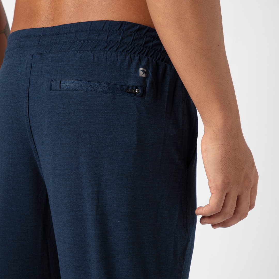 Tech Jogger Navy close up back zipper pocket on model