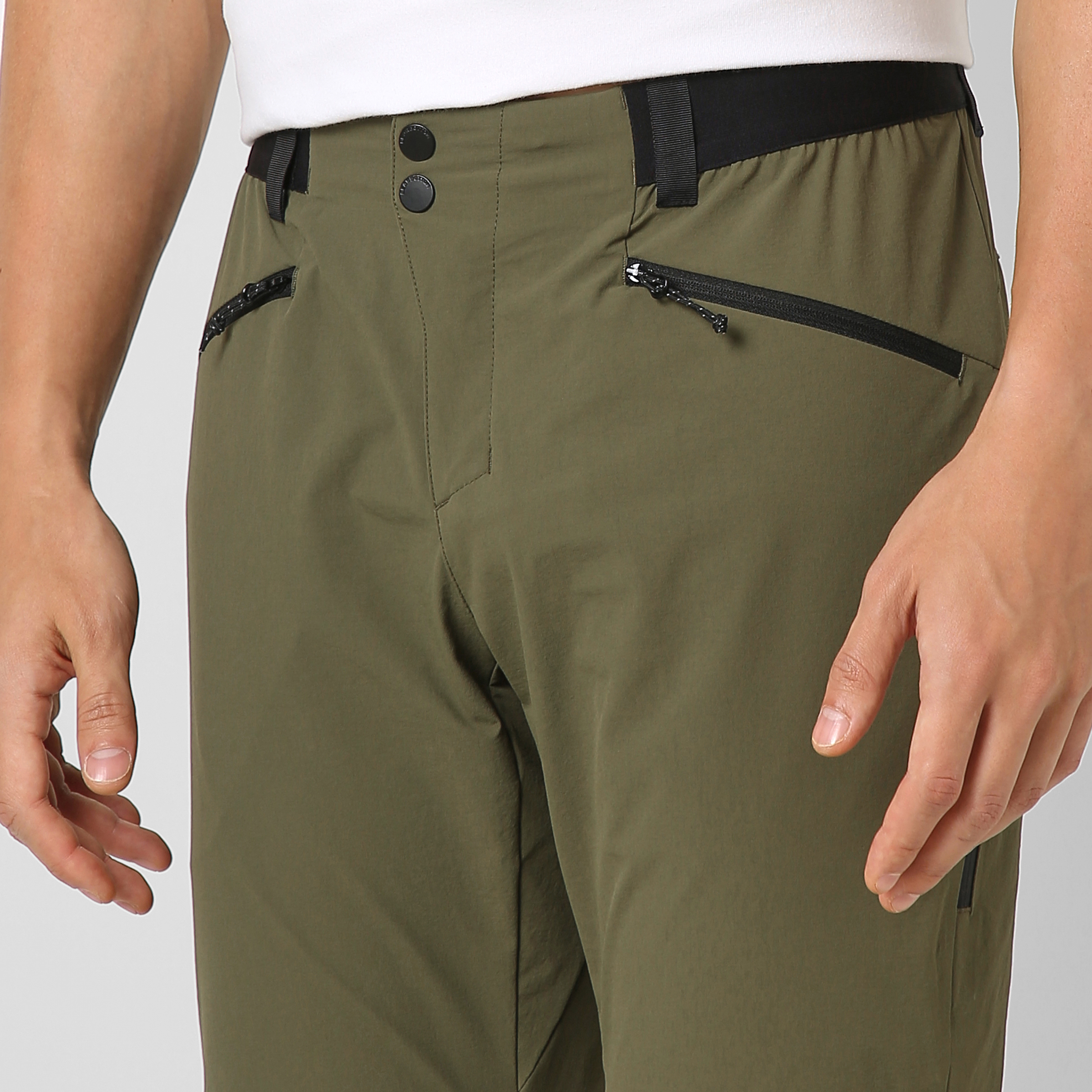 Trail Pant Military Green close up front left zipper pocket