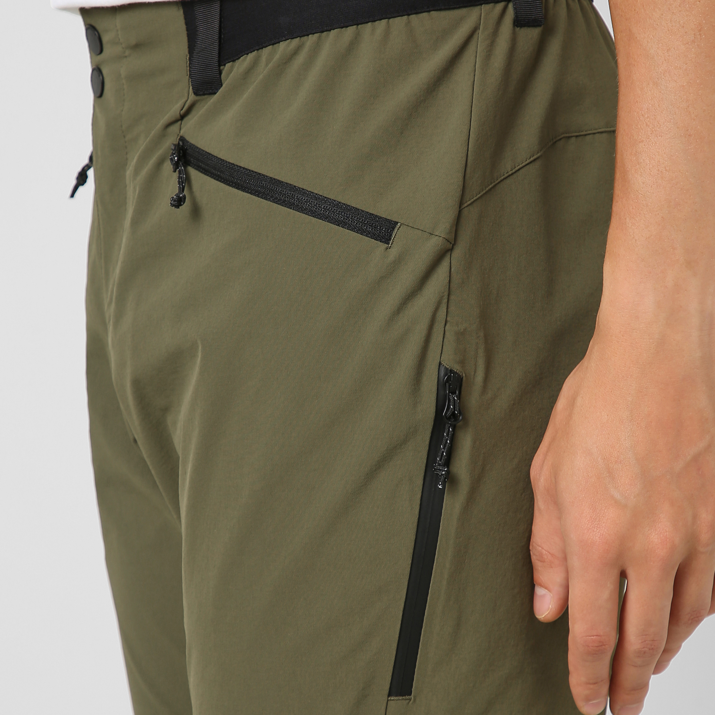 Trail Pant Military Green close up perforated side vent pocket