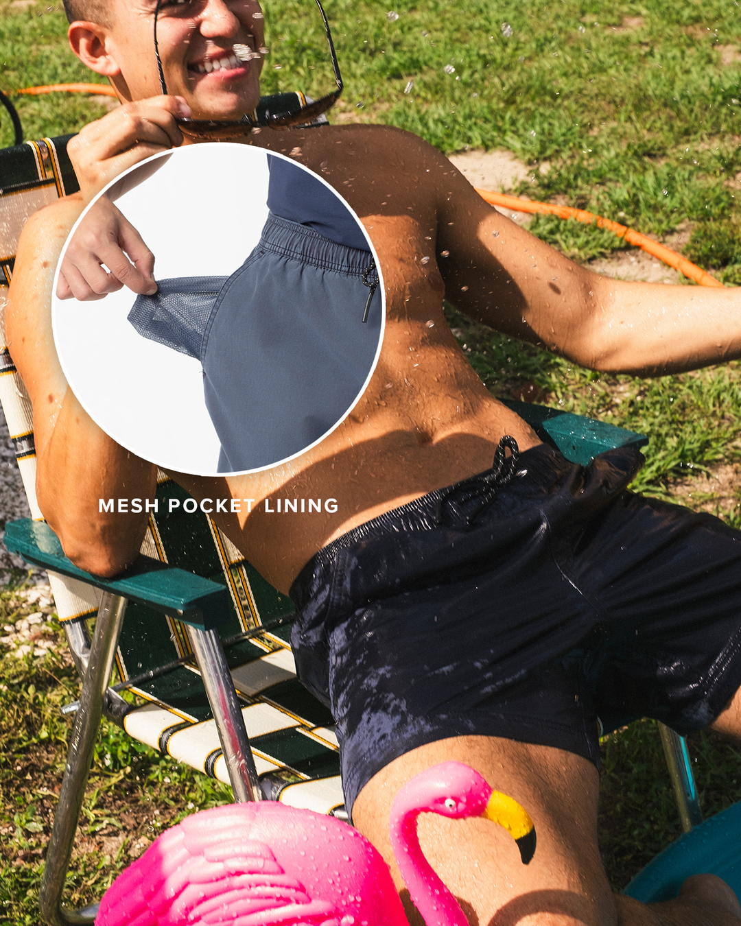 A man lounges outdoors in a folding chair wearing the Volley Shorts with a circular inset showing the mesh pocket lining of the shorts. The scene is set on grass with a pink flamingo decoration at the bottom.