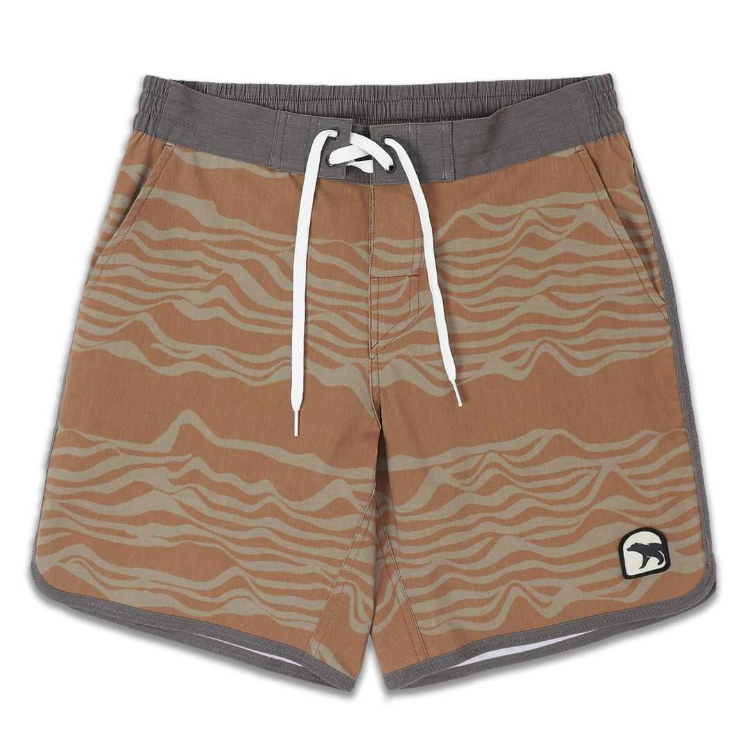 Board Short 8" Sahara an orange print with lighter orange sand dune waves with flat front grey waistband and a white drawstring, elastic back waistband, and patch bear logo on bottom left leg