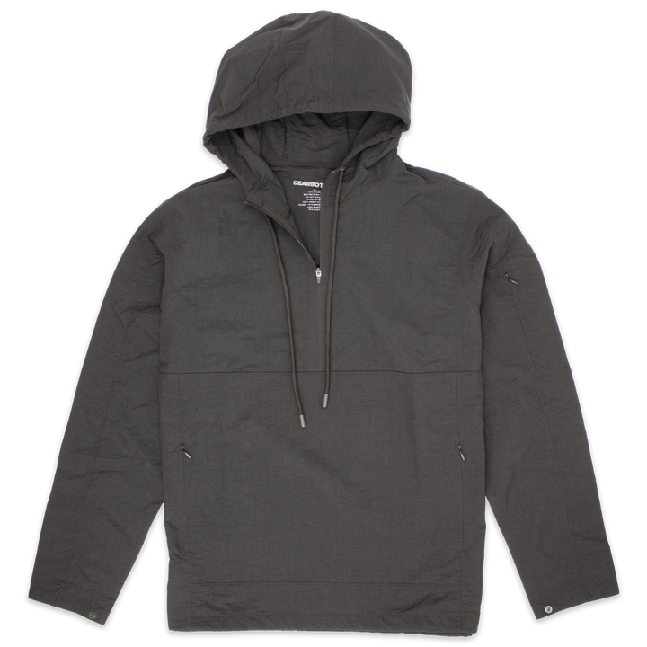 Windbreaker Jacket in Graphite grey with kangaroo pocket with zippers, zipper stash pocket on right arm, wrist snaps for secure fit, rubberized hood drawstring, and three-quarter zipper through collar