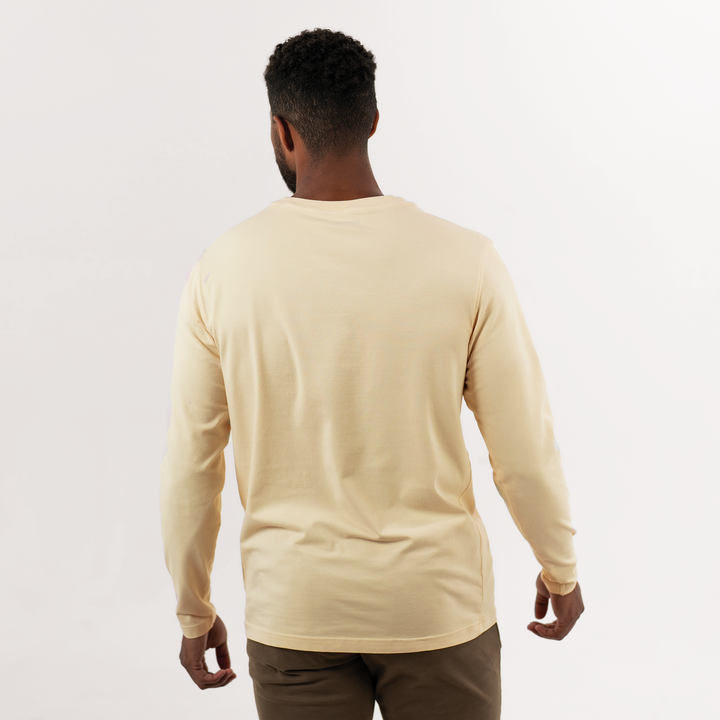 Natural Dye Logo Long Sleeve Tee in Sand yellow back on model