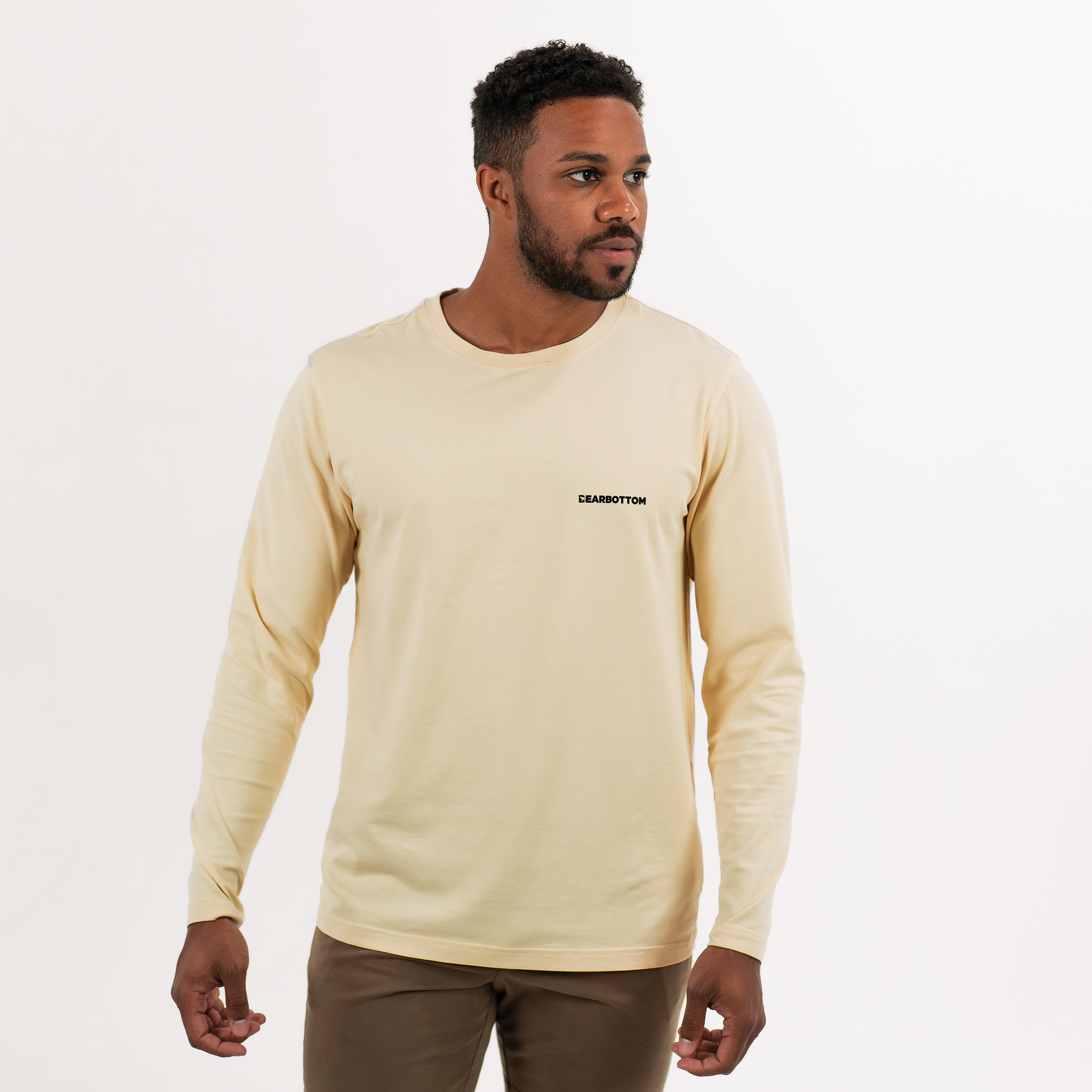Natural Dye Logo Long Sleeve Tee in Sand yellow front on model